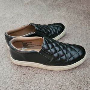 Black quilted slip on sneakers